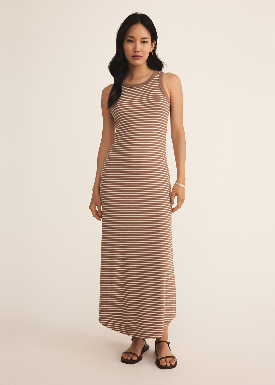 woman wearing brown and white horizontal stripe tank top maxi dress