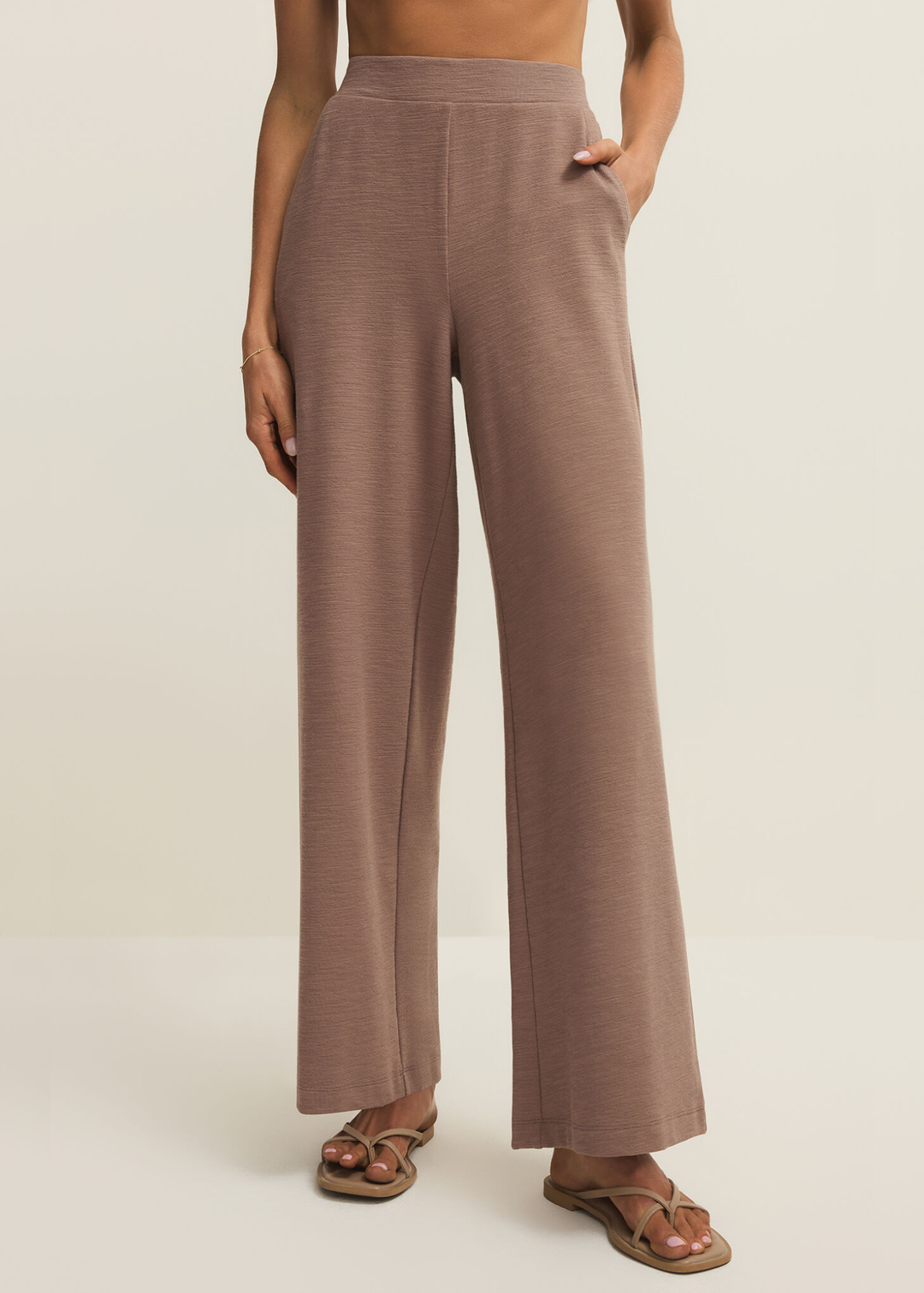 Woman wearing brown knit wide leg pants
