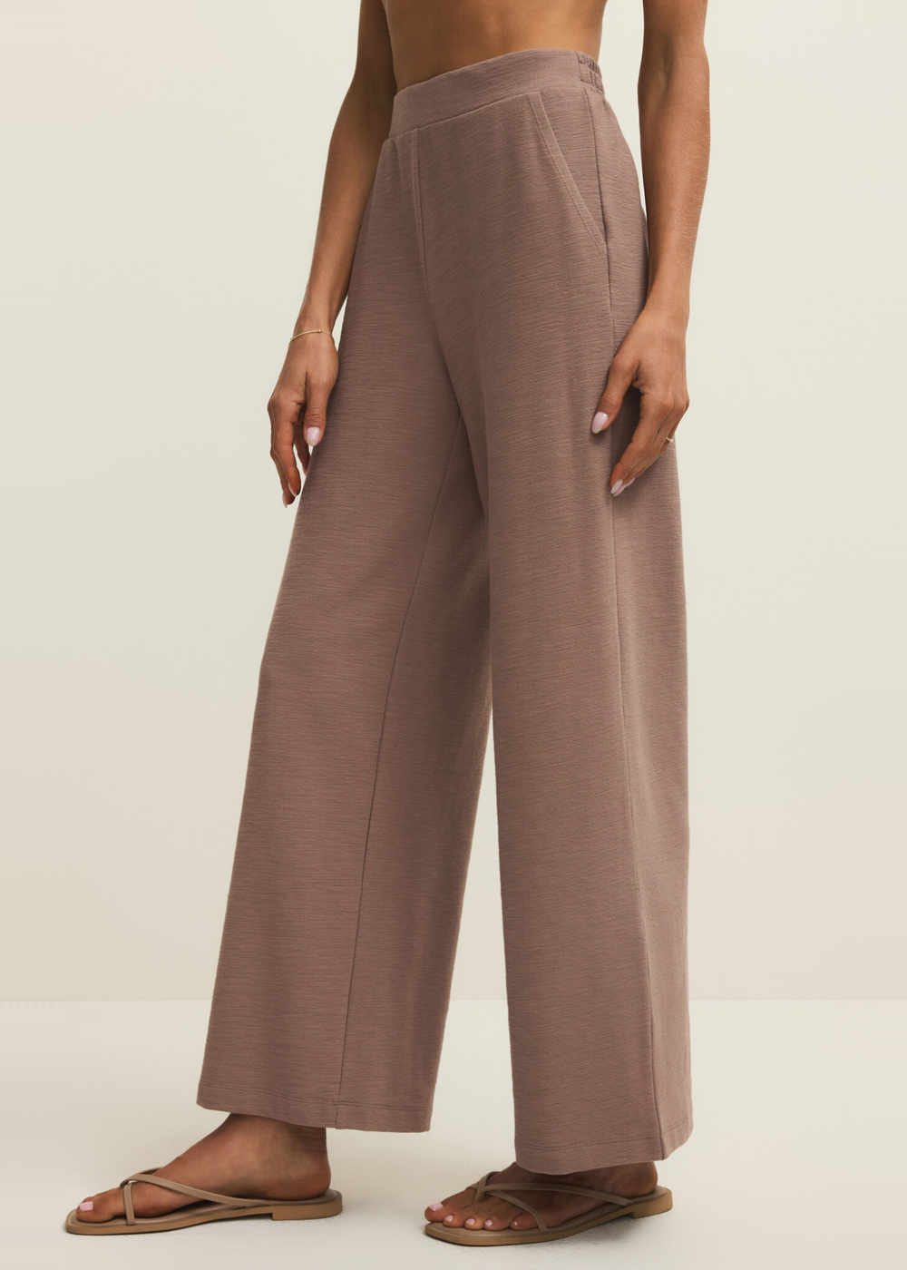 Woman wearing brown knit wide leg pants