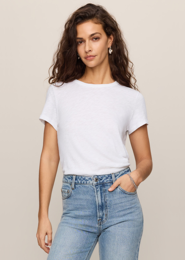 Woman wearing a white t-shirt with jeans