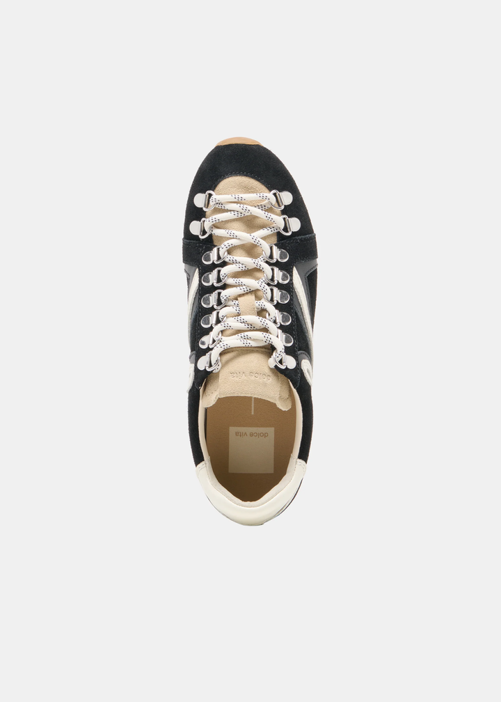 A single black suede sneaker with cream laces and a beige interior, shown from a top-down view on a light gray background.