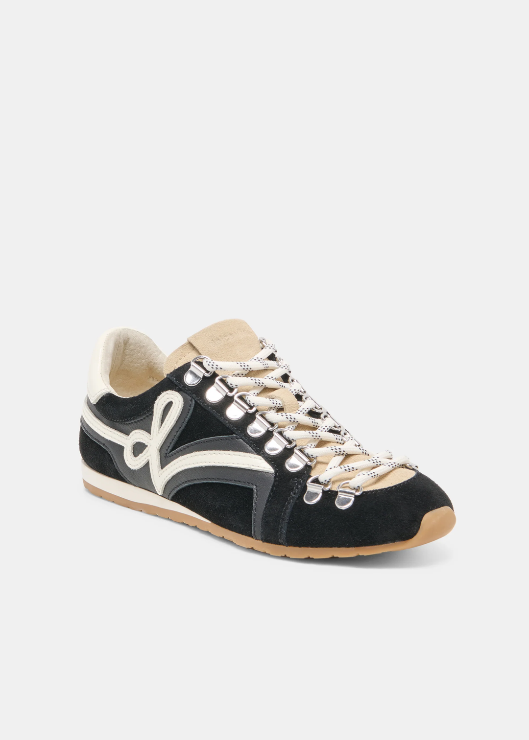 A black suede sneaker with beige laces, a beige rubber toe cap, and a white side stripe, shown on a light gray background.