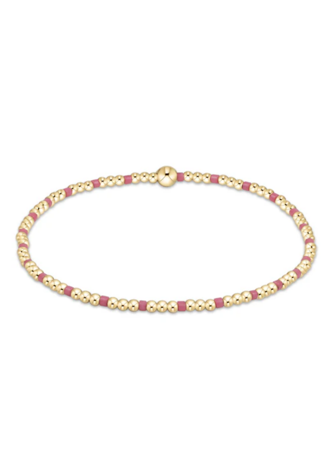 Little girl's bracelet with gold and pink beads on a white background