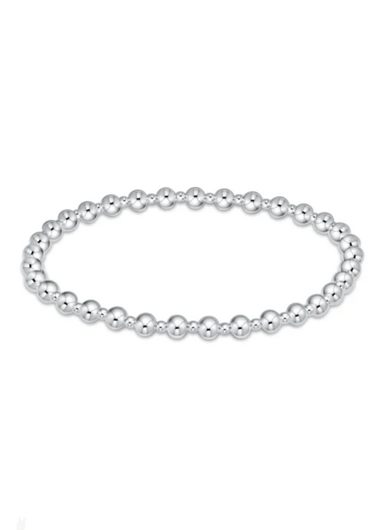 Women's sterling silver beaded bracelet with alternating bead sizes on a white background