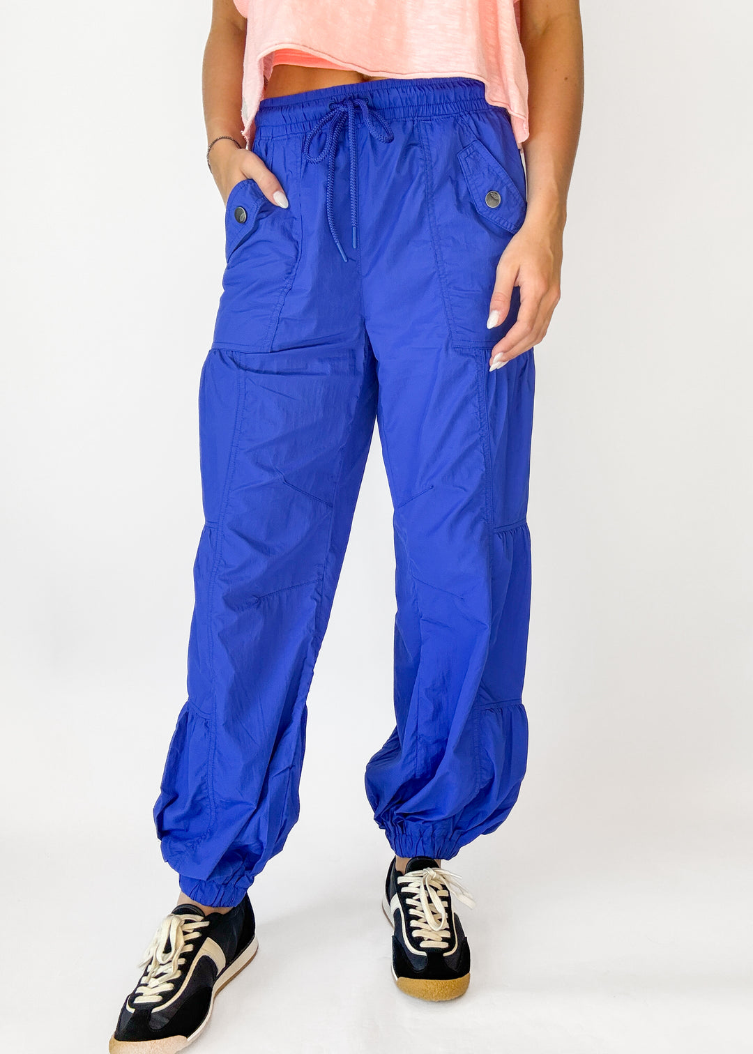 Person wearing blue pants on a white background