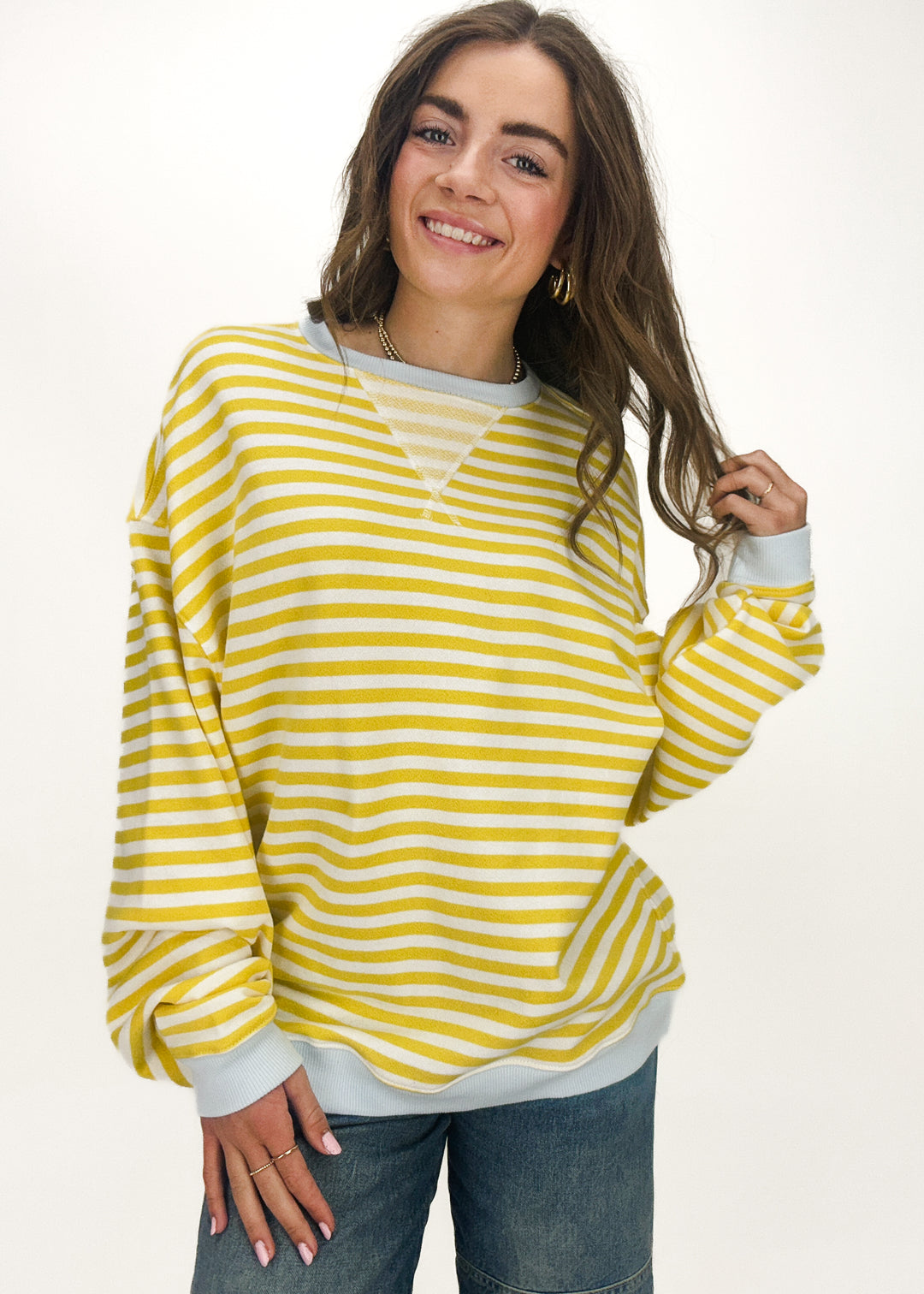 yellow striped crew neck sweatshirt with blue trim accents