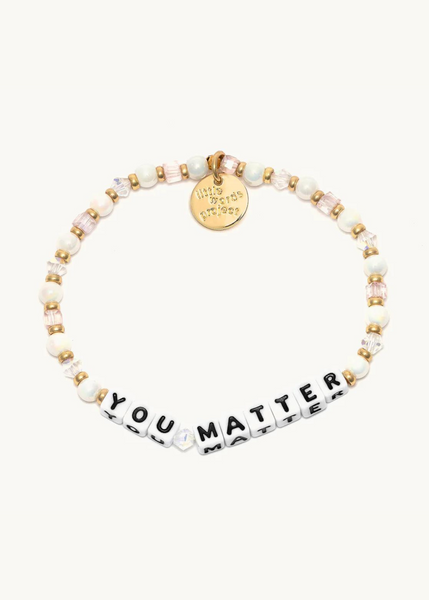 crystal bead bracelet with gold accents and square beads that read "you matter: