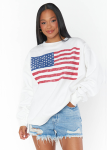 white oversized crew neck sweatshirt with vintage style distressed American flag graphic