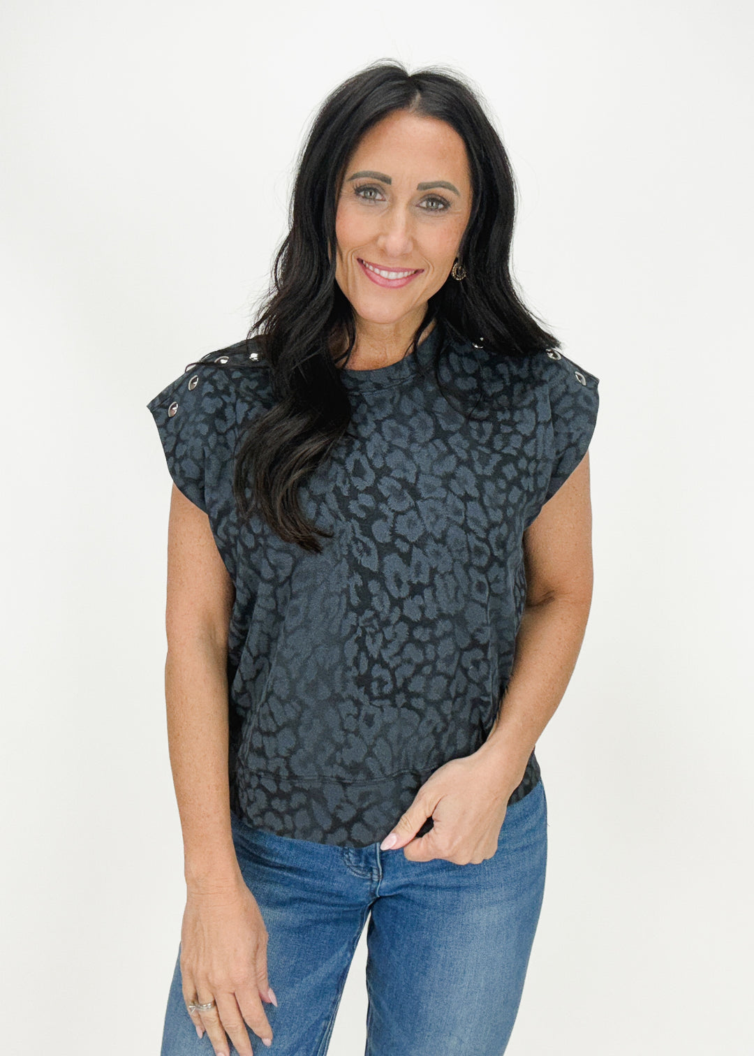 Black subtle leopard print short sleeve top with silver grommets at sleeves