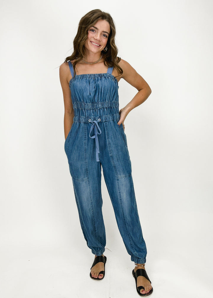 women's denim jumpsuit with elastic and drawstring waist, tank straps, and jogger-style pants