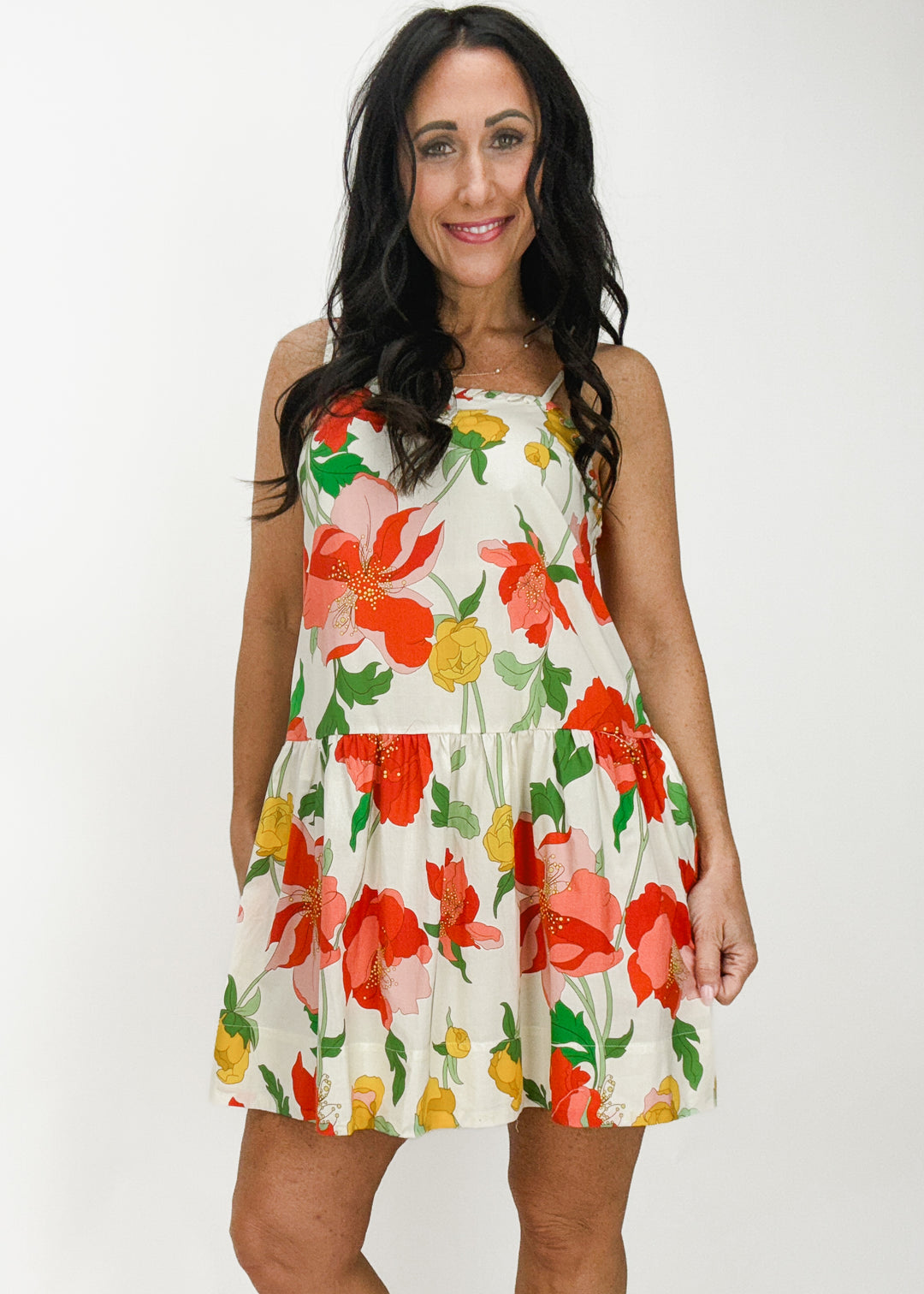 cream mini dress with pink, red, yellow, green floral print and ruffle skirt